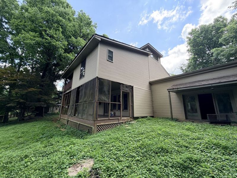 Rear of the property showing the screened porch and two-story wing